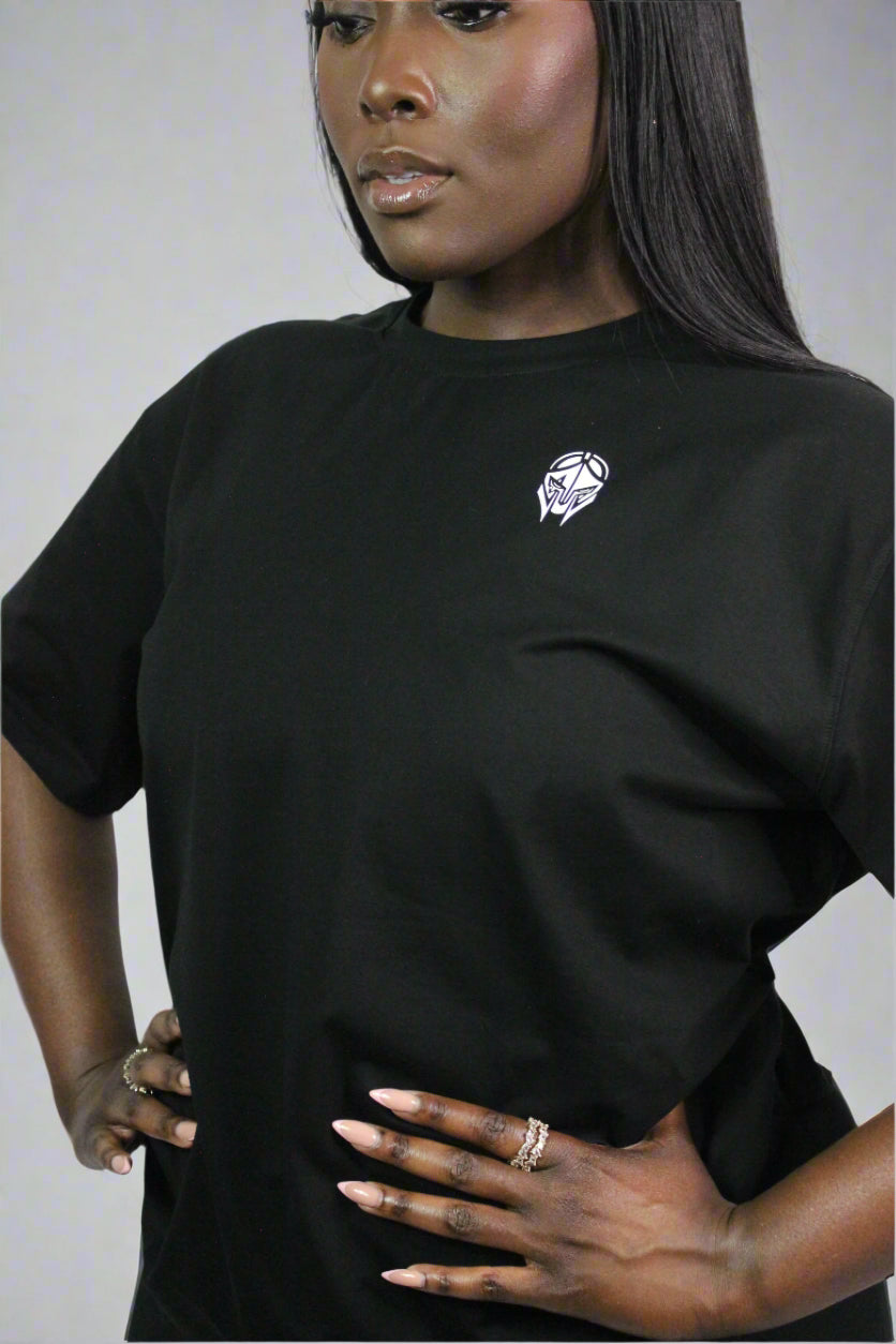 Black oversized Titans T-shirt displayed on a hanger, showcasing its relaxed fit and casual streetwear style.