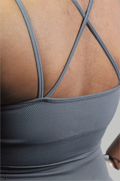 Grey Valkyrie Sports Bra by Titans, shown on a mannequin, featuring supportive straps and breathable fabric for activewear.
