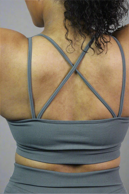 Grey Valkyrie Sports Bra by Titans, showing a close-up of the supportive athletic bra with logo details and breathable fabric.