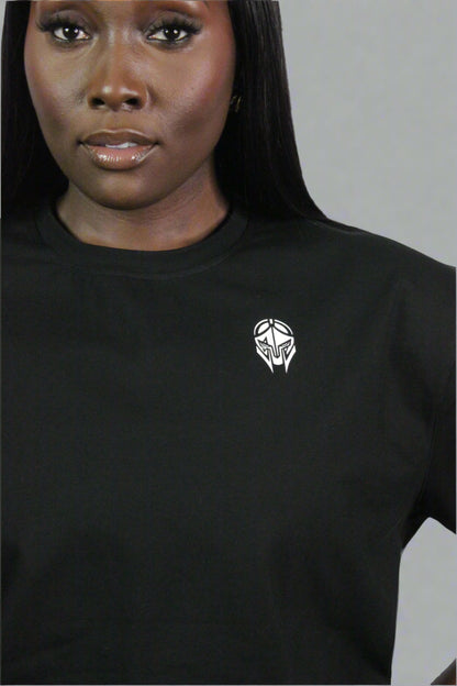 Black oversized Titans T-shirt displayed on a hanger showcasing its relaxed fit and casual style.