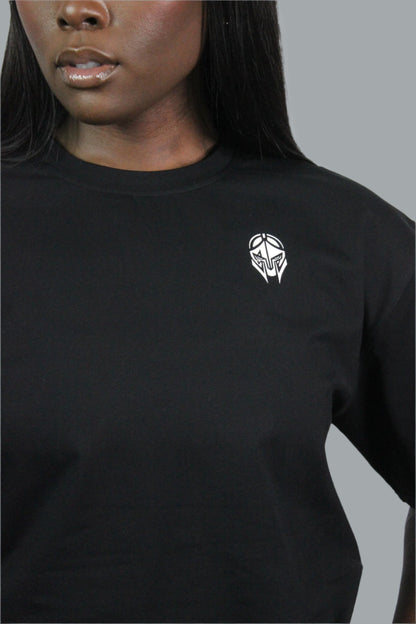Black oversized Titans t-shirt displayed flat, showcasing its relaxed fit and soft fabric.