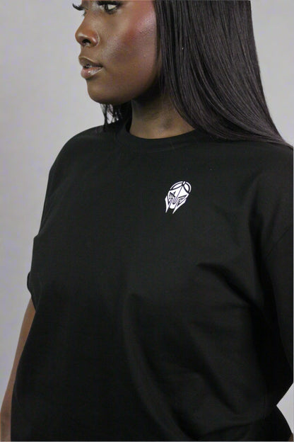 Black oversized Titans T-shirt displayed on a hanger, showcasing its relaxed fit and casual style.