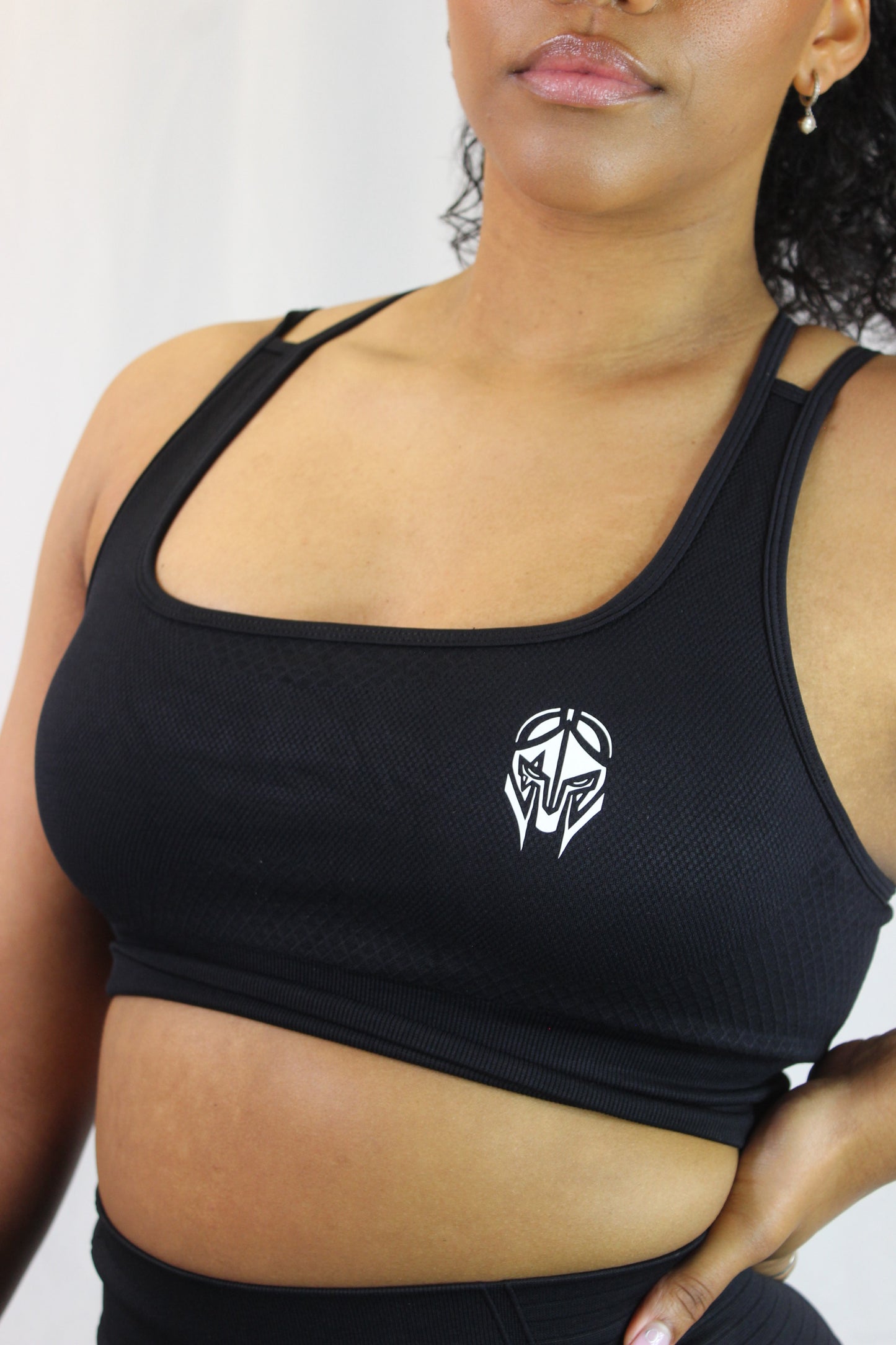 Black Valkyrie Sports Bra by Titans featuring a supportive design and comfortable fit, displayed on a mannequin.