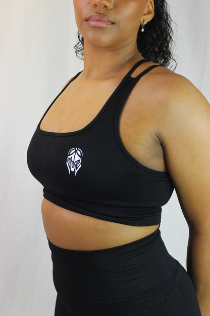 Black Valkyrie Sports Bra by Titans, shown on a model, featuring supportive design and breathable fabric for active wear.