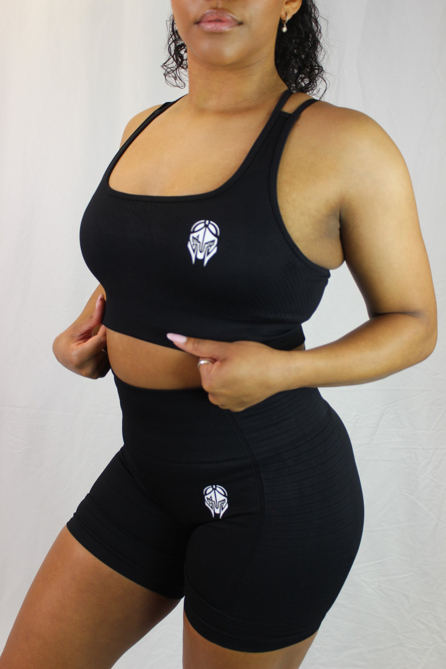 Black Valkyrie Sports Bra by Titans, showing the supportive athletic bra with sleek design and comfortable fit.