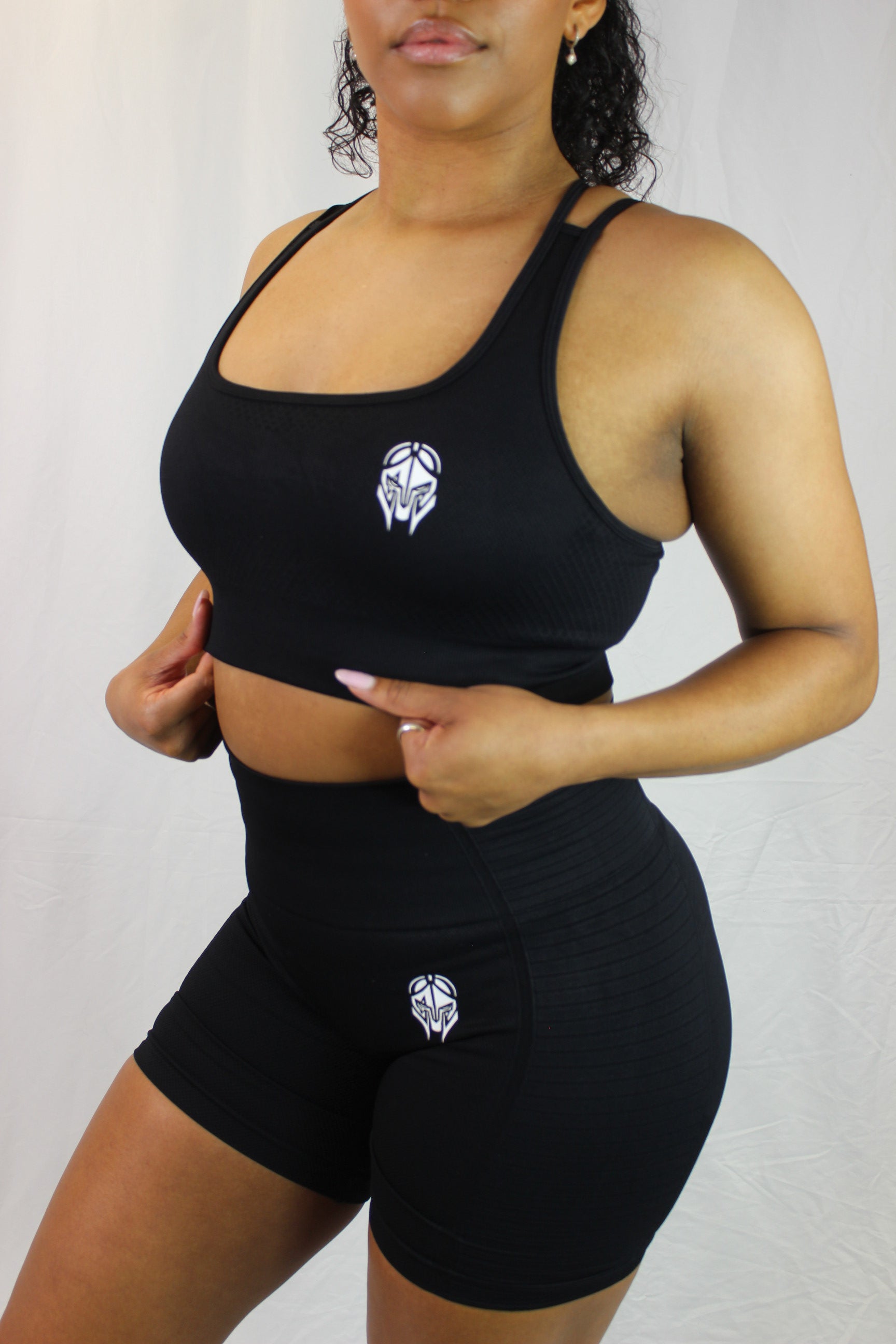 Black Valkyrie Sports Bra by Titans, showing the supportive athletic bra with sleek design and comfortable fit.