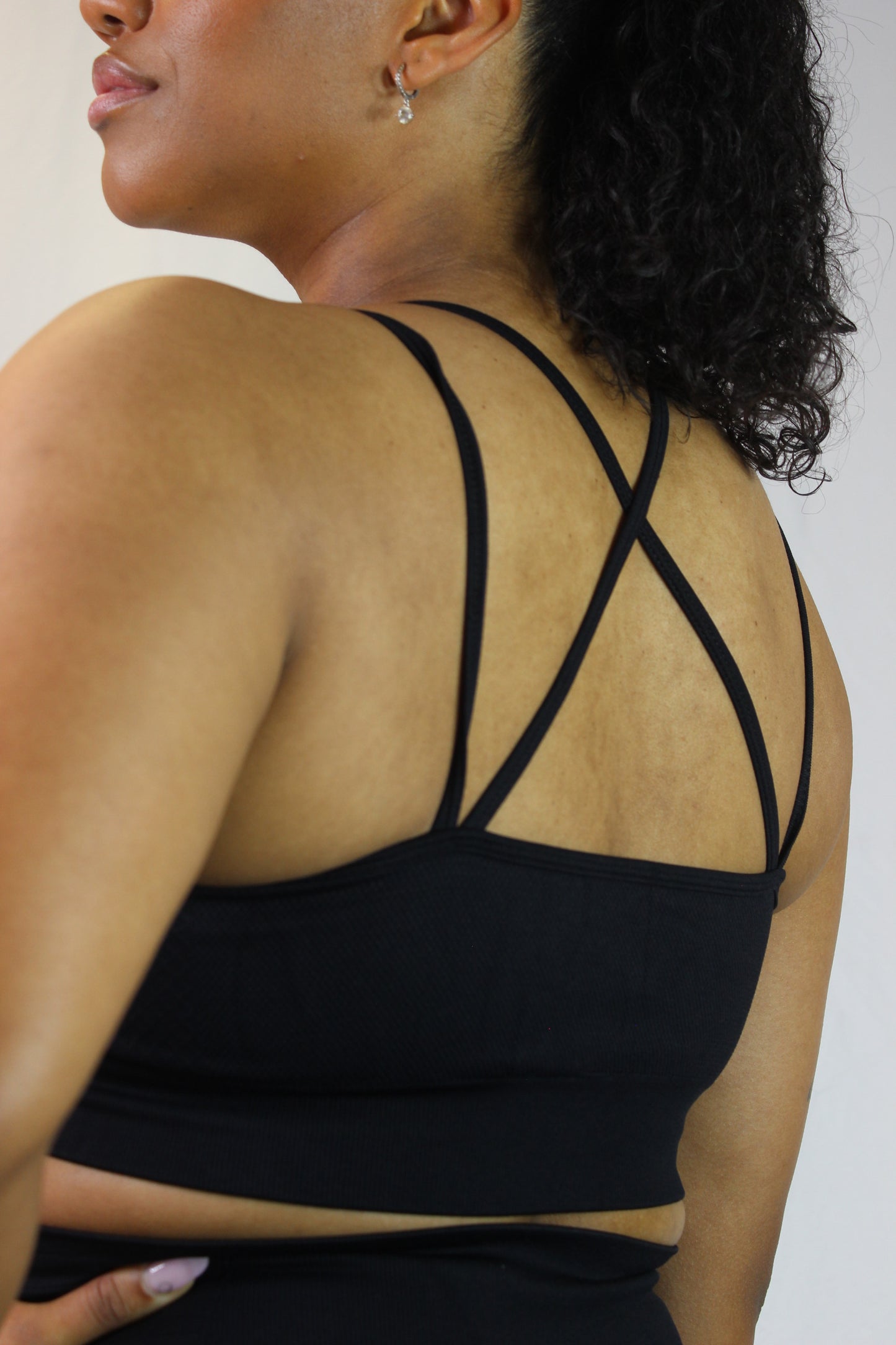 Black Titans Valkyrie sports bra with supportive fit and breathable fabric, ideal for workout and active wear.