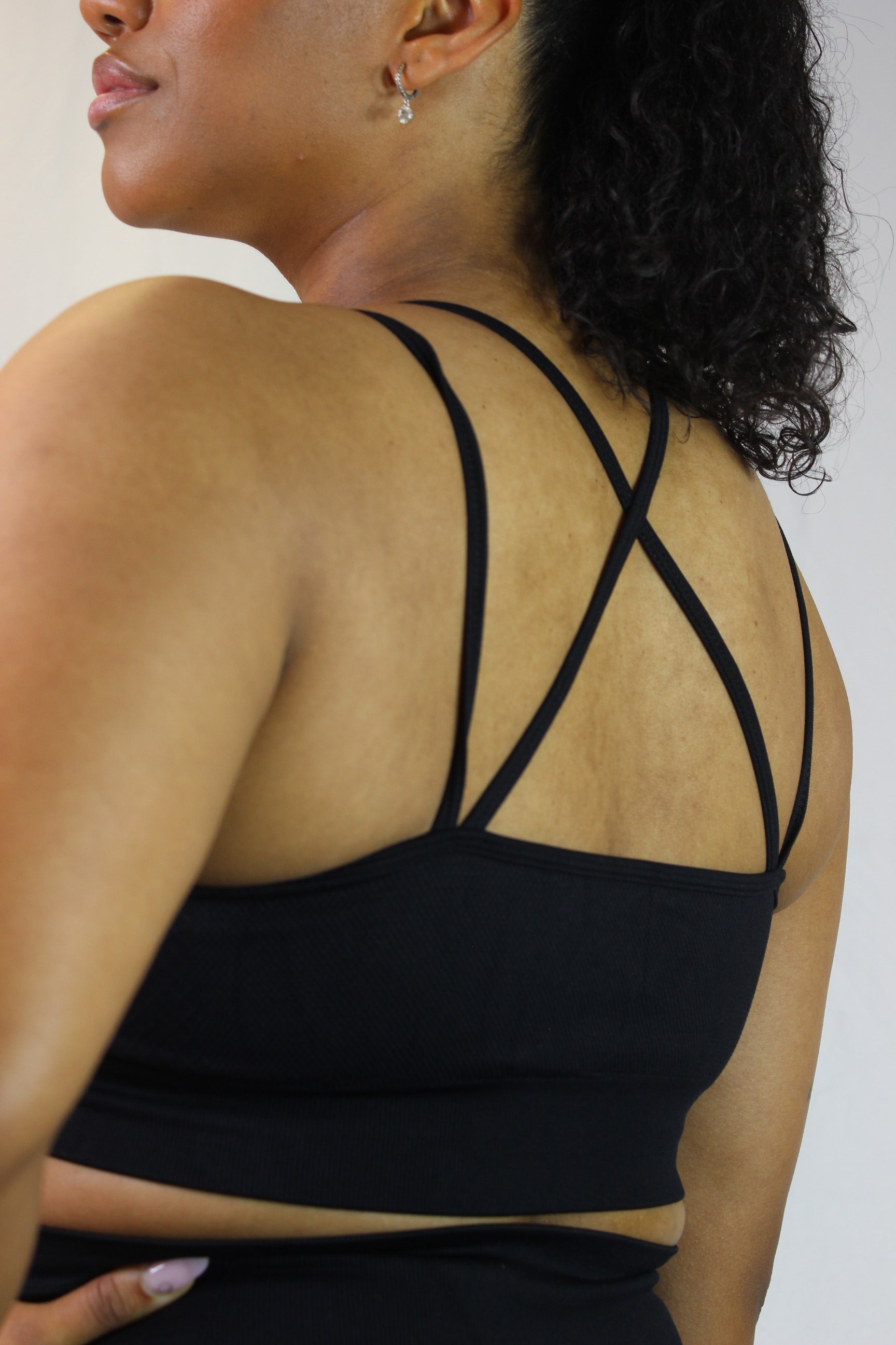Black Titans Valkyrie sports bra with supportive fit and breathable fabric, ideal for workout and active wear.